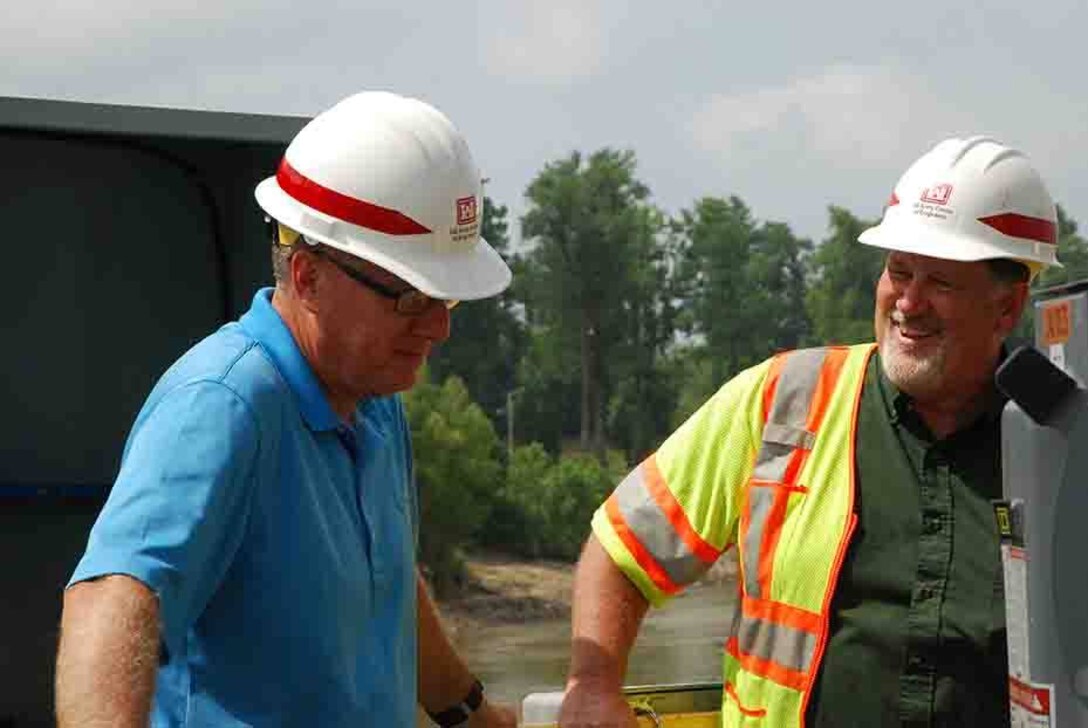 Left to right, Ed Dean and Dean Teeter discuss the progress of the Mhoon Landing site.