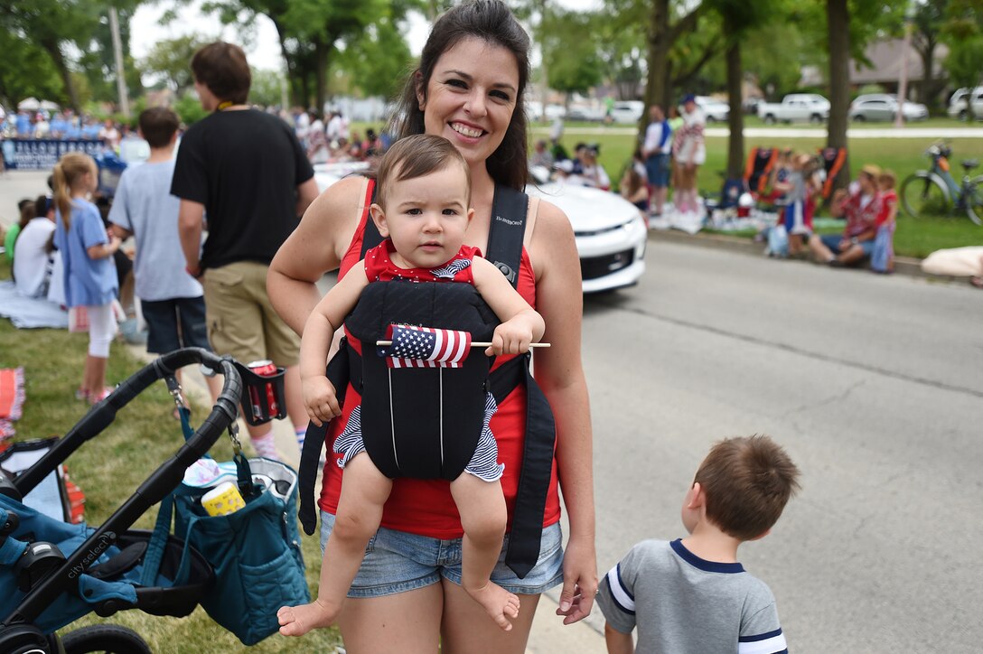 Sarah Jones, Elmhurst resident, with her ten-month-old son, Shay, pause for a photo during the Villa Park annual Fourth of July parade, July 4, 2016. Army Reserve soldiers assigned to the 85th Support Command and the 416th Theater Engineer Command participated in the parade.
(U.S. Army photo by Spc. David Lietz/Released)
