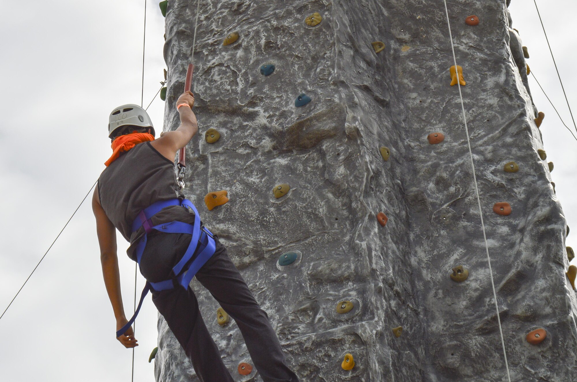 A member of the Youth Leadership Camp, sponsored by Air Force Services Agency Child and Youth Programs and hosted by Buckley Air Force Base, climbs the rock wall obstacle during a challenge June 27 – July 1 at the Snow Mountain Ranch in Granby, Colo. Youth from around the world came together to learn leadership techniques and build confidence for their future years of high school and beyond. (U.S. Air Force photo by Tech. Sgt. Nicholas Rau)