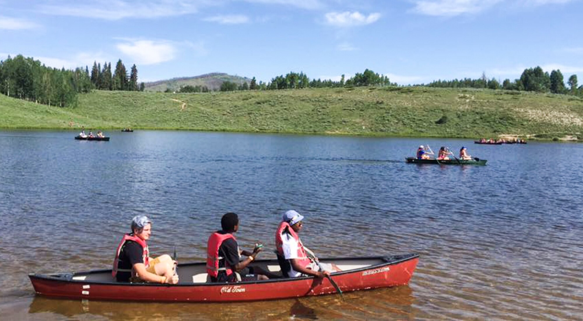 Members of the Youth Leadership Camp, sponsored by Air Force Services Agency Child and Youth Programs and hosted by Buckley Air Force Base, canoe June 27 – July 1 at the Snow Mountain Ranch in Granby, Colo. Youth from around the world came together to learn leadership techniques and build confidence for their future years of high school and beyond. (U.S. Air Force photo by Tech. Sgt. Nicholas Rau)