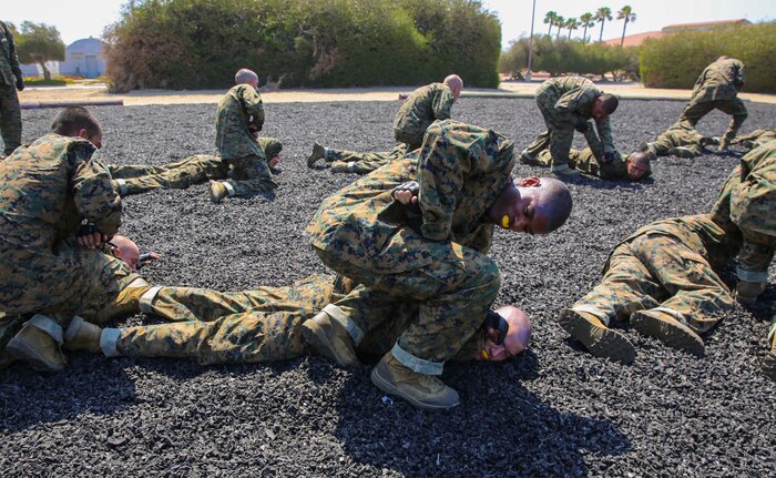 Recruits from Golf Company, 2nd Recruit Training Battalion, practice unarmed manipulations during a Marine Corps Martial Arts Program session at Marine Corps Recruit Depot San Diego, June 23. Recruits worked in pairs to practice the various techniques. One of the purposes of MCMAP is to teach recruits how to defeat the enemy using hand-to-hand combat. Annually, more than 17,000 males recruited from the Western Recruiting Region are trained at MCRD San Diego. Golf Company is scheduled to graduate Sept. 2.
