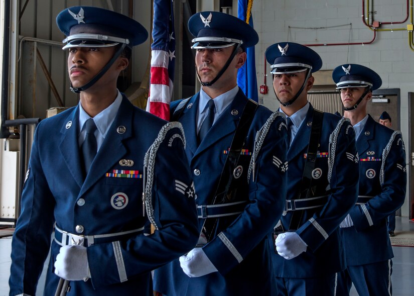 Joint Base Charleston Honor Guardsmen present colors during the 437th Airlift Wing Change of Command ceremony June 24, 2016, Joint Base Charleston, S. C. Honor guard members are chosen for their steadfast dedication to the integrity, service and excellence required to bring honor to the ceremonies the Air Force holds dear.  (U.S. Air Force Photo/Airman 1st Class Megan Munoz)