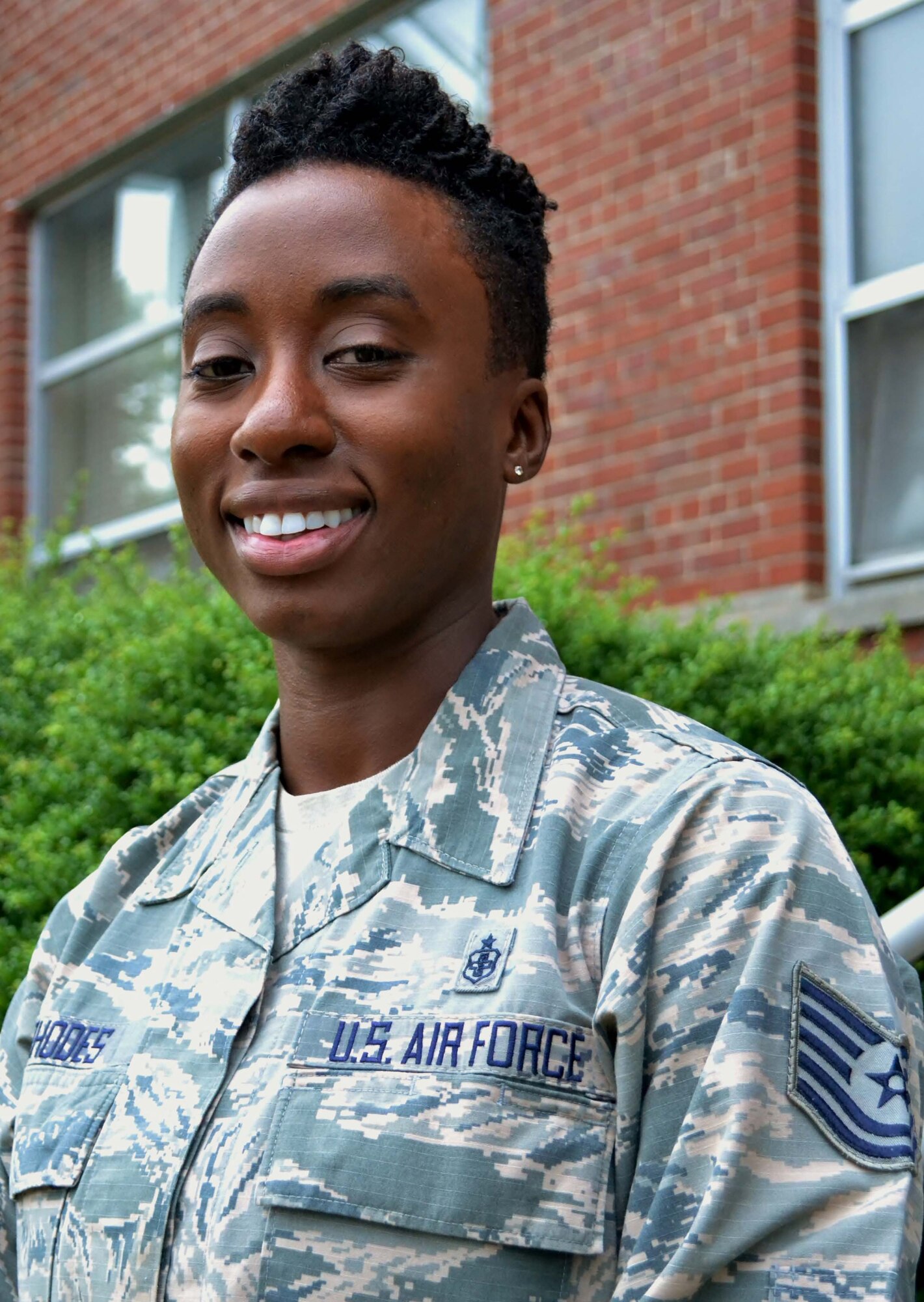 Tech. Sgt. Elisha Rhodes, a recruiter with the 111th Attack Wing's Strength Management Team, stands for photo at Horsham Air Guard Station, Pa., July 5, 2016. Rhodes is one the newest recruiters on the SMT here and has a background in the medical field from her time in the active-duty Air Force. (U.S. Air National Guard photo by Tech. Sgt. Andria Allmond)