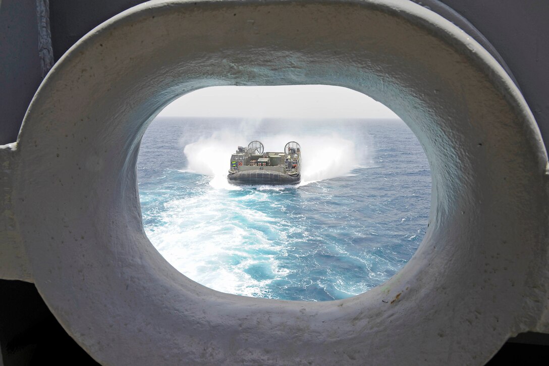 A landing craft, air cushion approaches the well deck of amphibious assault ship USS Boxer in the Arabian Gulf, July 2, 2016. Navy photo by Petty Officer 2nd Class Jose Jaen