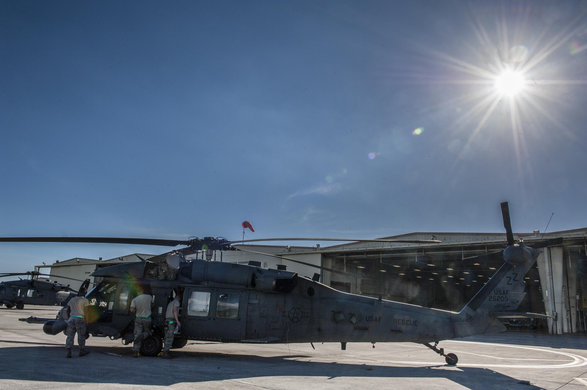 Maintainers with the 33rd Helicopter Maintenance Unit go through a pre-flight checklist June 20, 2016, at Kadena Air Base, Japan. The HH-60G Pave Hawk went on a training sortie in preparation for contingency operations in the Indo-Asia Pacific Region. (U.S. Air Force photo by Airman 1st Class Lynette M. Rolen)