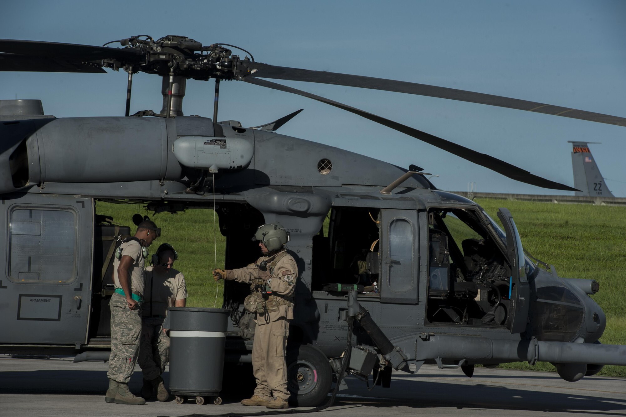 U.S. Air Force Airman 1st Class Sean Woolridge, Staff Sgt. Riley Smith, 33rd Helicopter Maintenance Unit crew chiefs and Jon Miller, 33rd Rescue Squadron special mission aviator, complete a hoist inspection June 20, 2016, at Kadena Air Base, Japan. The hoist is one of the greatest assets to the HH-60G Pave Hawk’s search and rescue missions. (U.S. Air Force photo by Airman 1st Class Lynette M. Rolen)