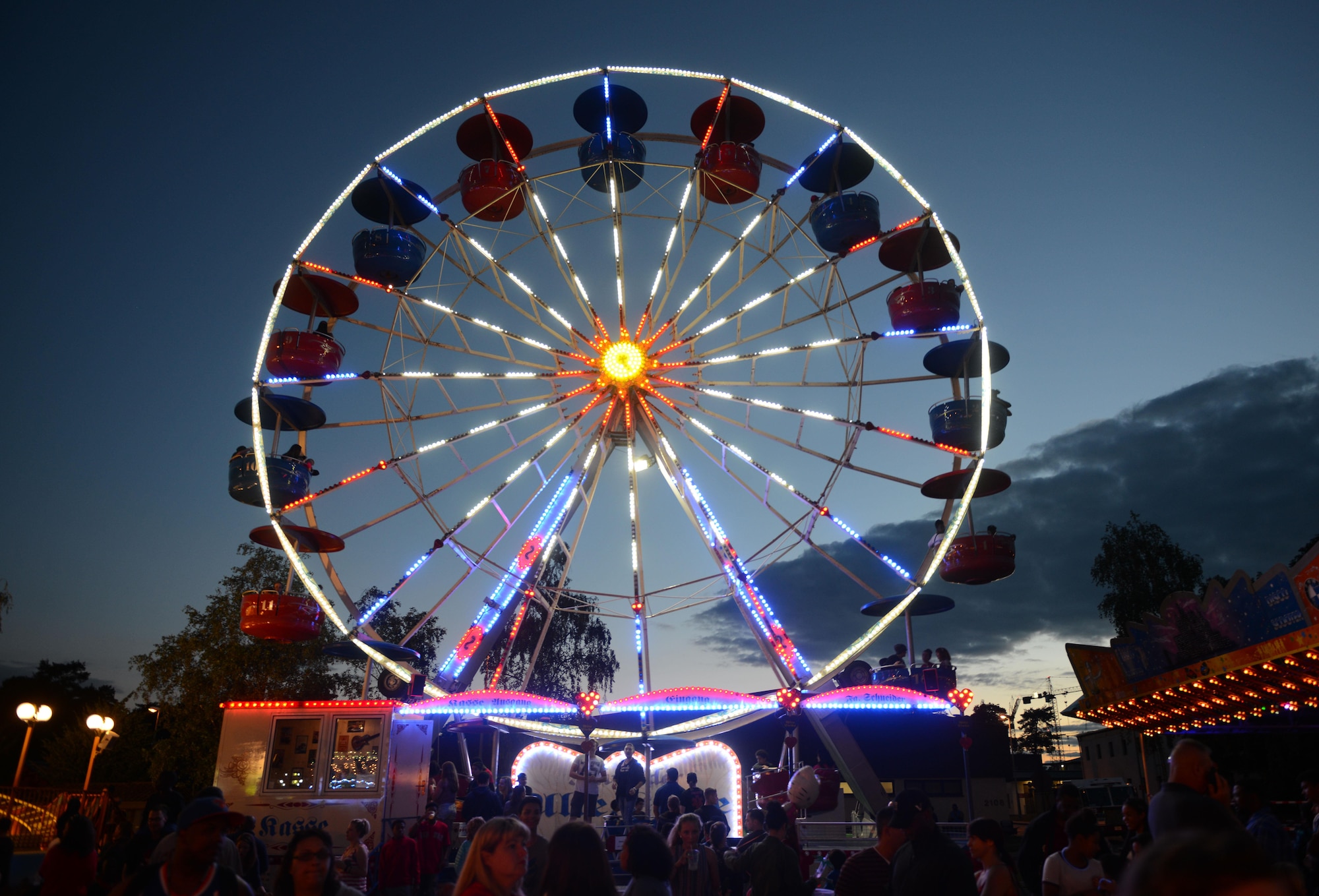 Carnival goers attend the Freedom Fest 2016 festivities at Ramstein Air Base, Germany, July 4, 2016. The Independence Day celebration included a variety of foods, games, rides and fireworks for Kaiserslautern Military Community members. The festival culminated with a fireworks display in the evening. (U.S. Air Force photo/ Airman 1st Class Joshua Magbanua)