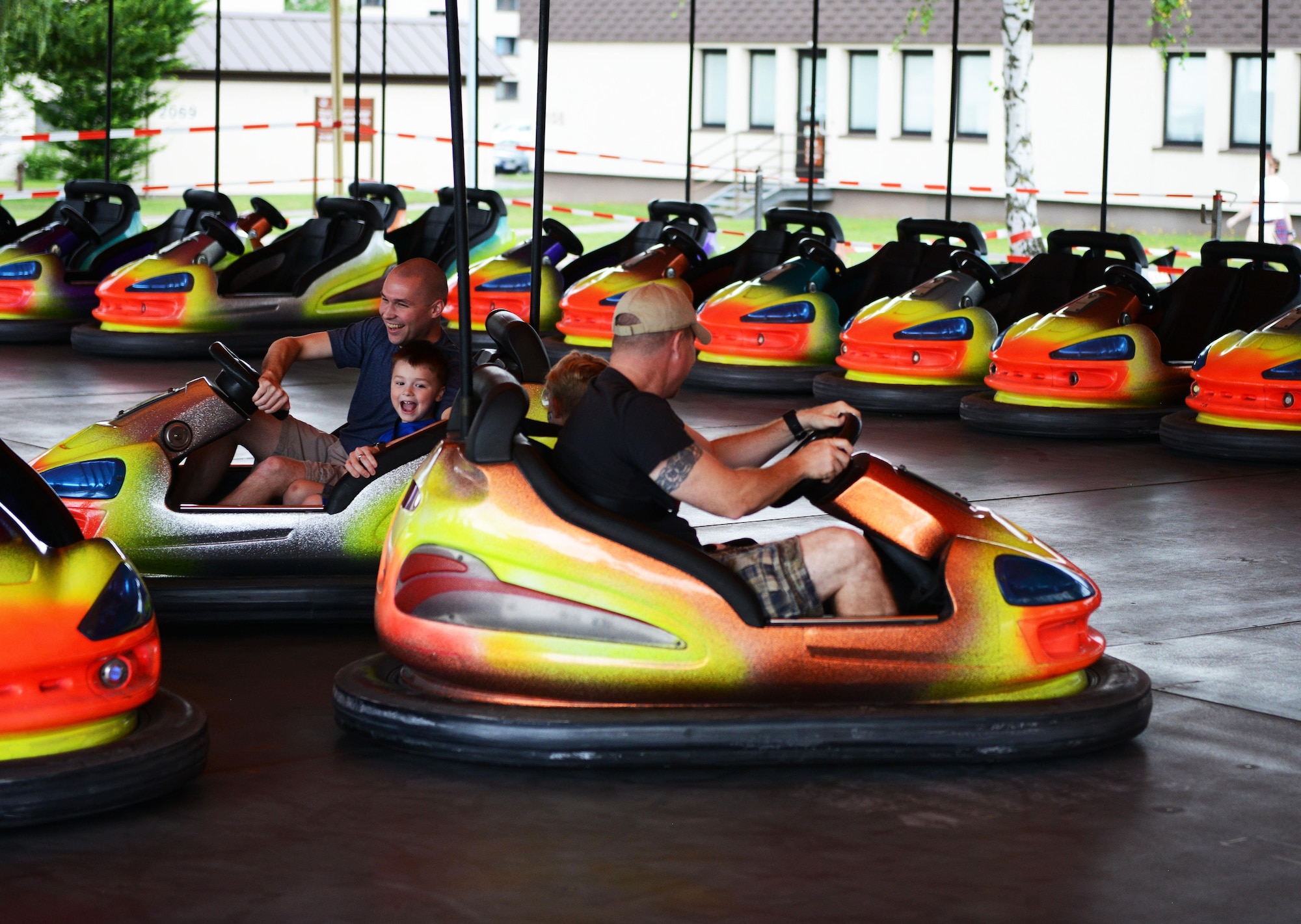 Festival goers enjoy a bumper car ride during Freedom Fest 2016 at Ramstein Air Base, Germany, July 4, 2016. The Independence Day celebration included a variety of foods, games, rides and fireworks for Kaiserslautern Military Community members. The event was sponsored by the 86th Force Support Squadron. (U.S. Air Force Photo/ Airman 1st Class Joshua Magbanua)