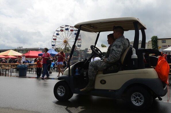 86th Security Forces Squadron members conduct a patrol during Freedom Fest 2016 at Ramstein Air Base, Germany, July 4, 2016. The Independence Day celebration included a variety of foods, games, rides and fireworks for Kaiserslautern Military Community members. (U.S. Air Force Photo/ Airman 1st Class Joshua Magbanua)