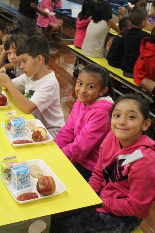Students at Eugene Field Elementary School in Oklahoma enjoy a nutritious meal during their five-week summer school program. DLA Troop Support's Subsistence supply chain provides produce to schools in 48 states in partnership with the U.S Department of Agriculture.