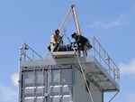 The California National Guard's 9th Civil Support Team (CST) tests a 
platform and hoist system the team designed for the QinetiQ Talon robot 
during a May exercise in San Diego focused on preventing international 
smuggling of radiation sources. The Los Alamitos-based CST specializes in
responding to incidents involving a chemical, biological, radiological or
nuclear contaminant. 