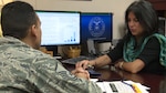 Criselda Smith, Joint Base San Antonio-Randolph Military & Family Readiness Consultant, works with a client to explore investment options for the Thrift Savings Plan Feb. 10, 2016 at JBSA-Randolph. Military and family readiness centers throughout the Air Force provide an array of programs and services that promote self-reliance and contribute to mission readiness.

