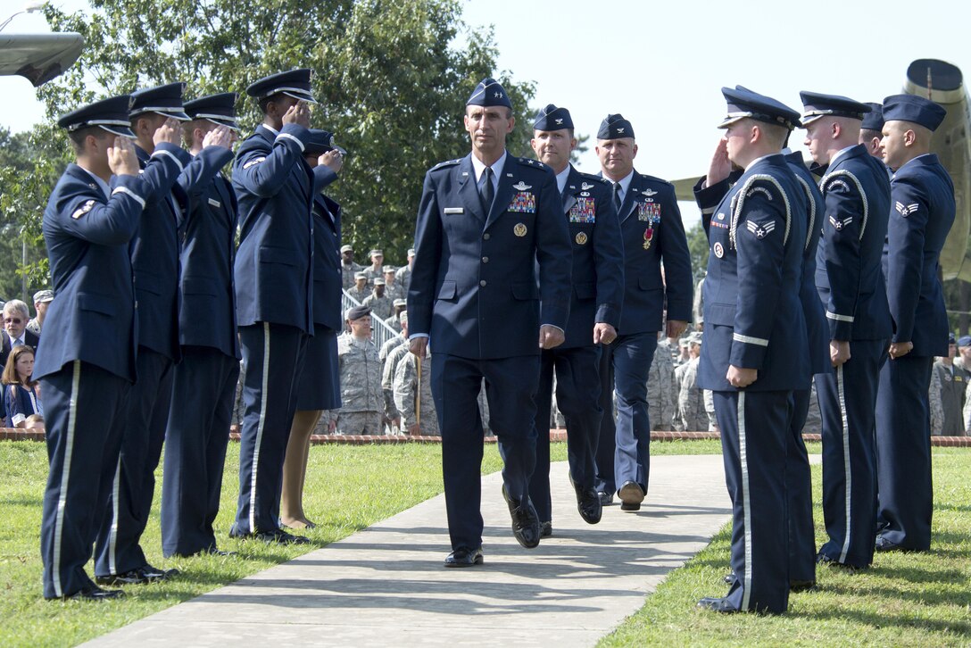 Maj. Gen. Scott Zobrist, Ninth Air Force commander, Col. Christopher Sage, incoming 4th Fighter Wing commander, and Col. Mark Slocum, outgoing 4th Fighter Wing commander, depart the 4th Fighter Wing change of command ceremony, June 30, 2016, at Seymour Johnson Air Force Base, North Carolina. Slocum relinquished command to Sage following a two year assignment as the 4th FW commander. (U.S. Air Force photo/Tech. Sgt. Chuck Broadway)