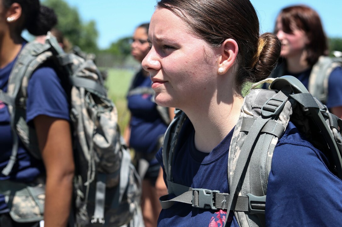 U.S. Marine Corps enlistee Chartre Deshong, from Recruiting Substation Carlisle, stands at attention in formation after a 4-mile hike through the Appalachian Trail in Carlisle, Penn., on Saturday, June 18, 2016. Two miles into the hike, the poolees were given 20 minutes for lunch during which proper nutrition habits were discussed. The purpose of the hike was to provide training as well as mentorship to female poolees by teaching them the proper way to pack and carry heavy loads during hikes prior to leaving for boot camp.  (U.S. Marine Corps photo by Sgt. Anne K. Henry/Released)