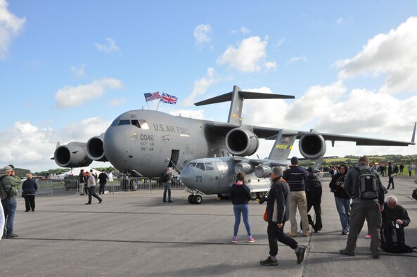 A C-17 Globemaster III from Joint Base Charleston, S.C., and the 315th Airlift Wing's mini C-17 were popular attractions at the Yeovilton Air Day 2016 at Royal Naval Air Station Yeovilton, England, on July 2, 2016. Nearly 40,000 people crowded into the small British Navy base in order to get peek at aircraft from all over the world. Reservists from the 315th AW participated in the annual air show and they were also awarded the show’s top prize, the best static display award. (U.S. Air Force photo/Maj. Wayne Capps)