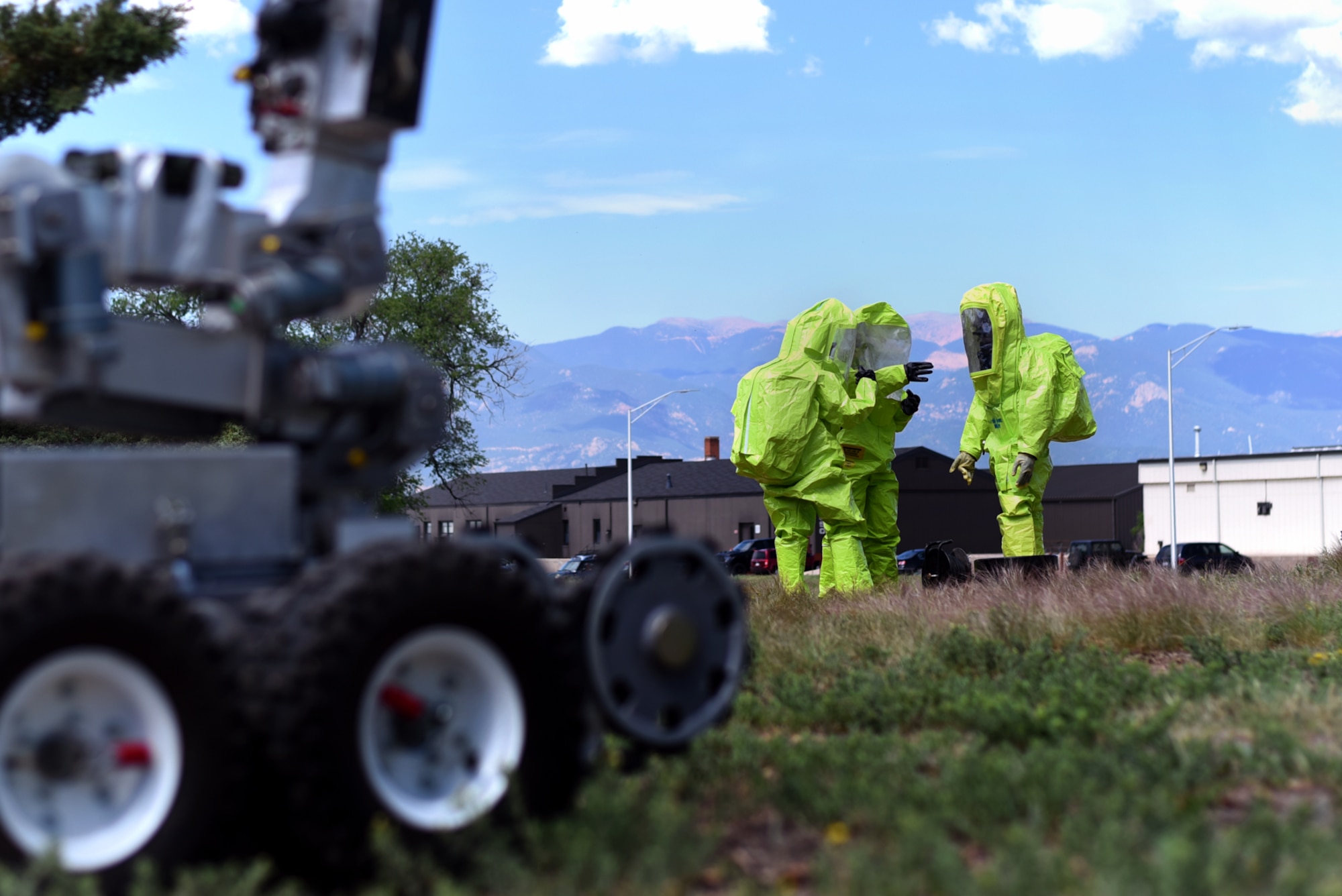 A team assigned to the 21st Explosive Ordnance Disposal Flight plan their strategy on disposing of an unexploded ordnance during a chemical operation training exercise at Peterson Air Force Base, Colo., June 24, 2016. The team relied on their tactics, techniques and procedures to successful dispose of the chemical ordnance. (U.S. Air Force photo by Airman 1st Class Dennis Hoffman)