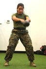 Marines stationed aboard Marine Corps Air Station New River execute kettlebell swings in the tactical shuttle at the Tactical Athlete Competition on the air station June 24. The competition served as the qualifying competition, where top male and female Marines from each installation would have the opportunity to compete for the finals at Miramar. (U.S. Marine Corps photo by Cpl. Mark Watola /Released)