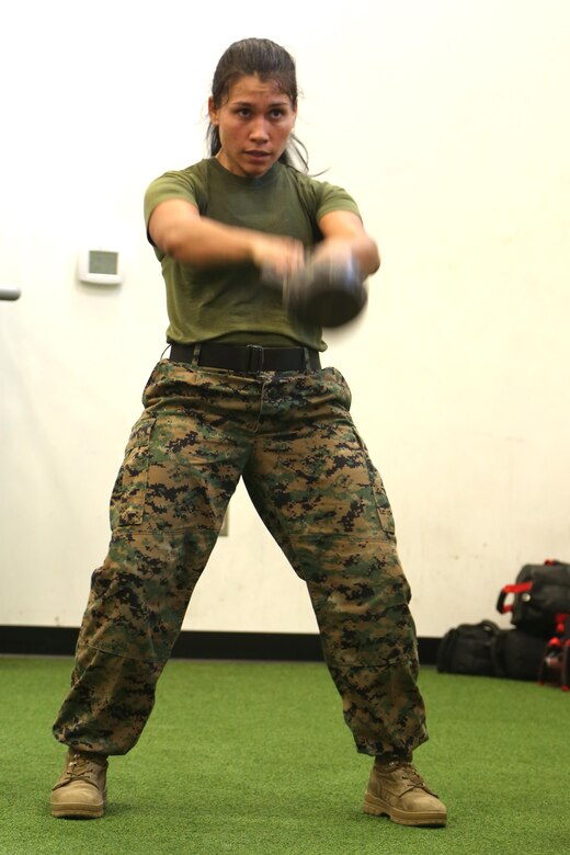 Marines stationed aboard Marine Corps Air Station New River execute kettlebell swings in the tactical shuttle at the Tactical Athlete Competition on the air station June 24. The competition served as the qualifying competition, where top male and female Marines from each installation would have the opportunity to compete for the finals at Miramar. (U.S. Marine Corps photo by Cpl. Mark Watola /Released)
