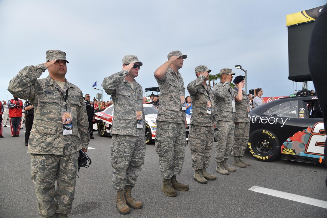 Airmen assigned to the 927th Air Refueling Wing, MacDill Air Force Base, Fla., were invited to participate in the honorary pit crew experience at the Coke Zero 400 NASCAR race at the Daytona International Speedway, Friday, July 1, 2016. Each Airmen and their guest were offered a chance to turn a wrench on a racecar and watch the team as they changed the tires and prepared the cars for the race. (U.S. Air Force photo by Staff Sgt. Adam C. Borgman)

