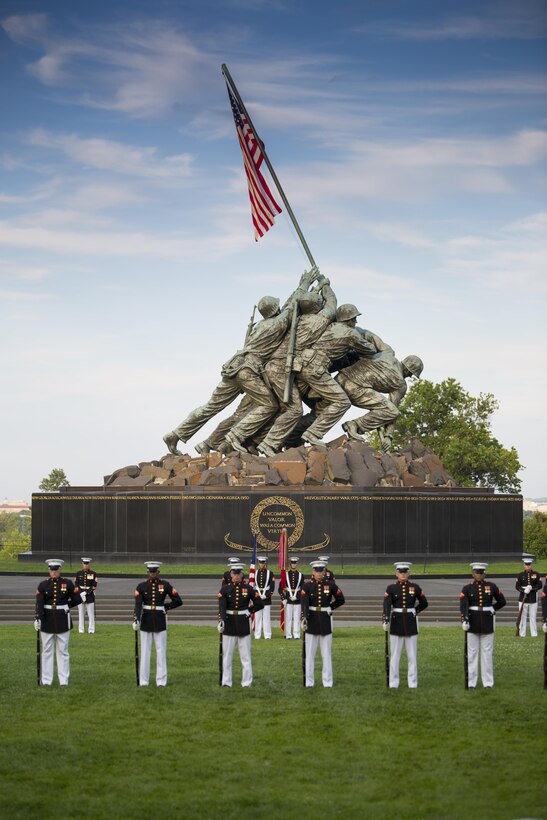 The United States Marine Corps Silent Drill Platoon performs during the Sunset Parade at Arlington, Va., July 5, 2016. The guests of honor for the parade were Mr. Brian L. Potts, majority staff director, Senate Appropriations Committee – Defense, Mr. Erik K. Raven, minority staff director, Senate Appropriations Committee – Defense, and Mrs. Rebecca Leggieri, House Appropriations Committee – Defense. The hosting official was Lt. Gen. Glenn M. Walters, deputy commandant, Programs and Resources. (Official Marine Corps photo by Lance Cpl. Robert Knapp/Released)