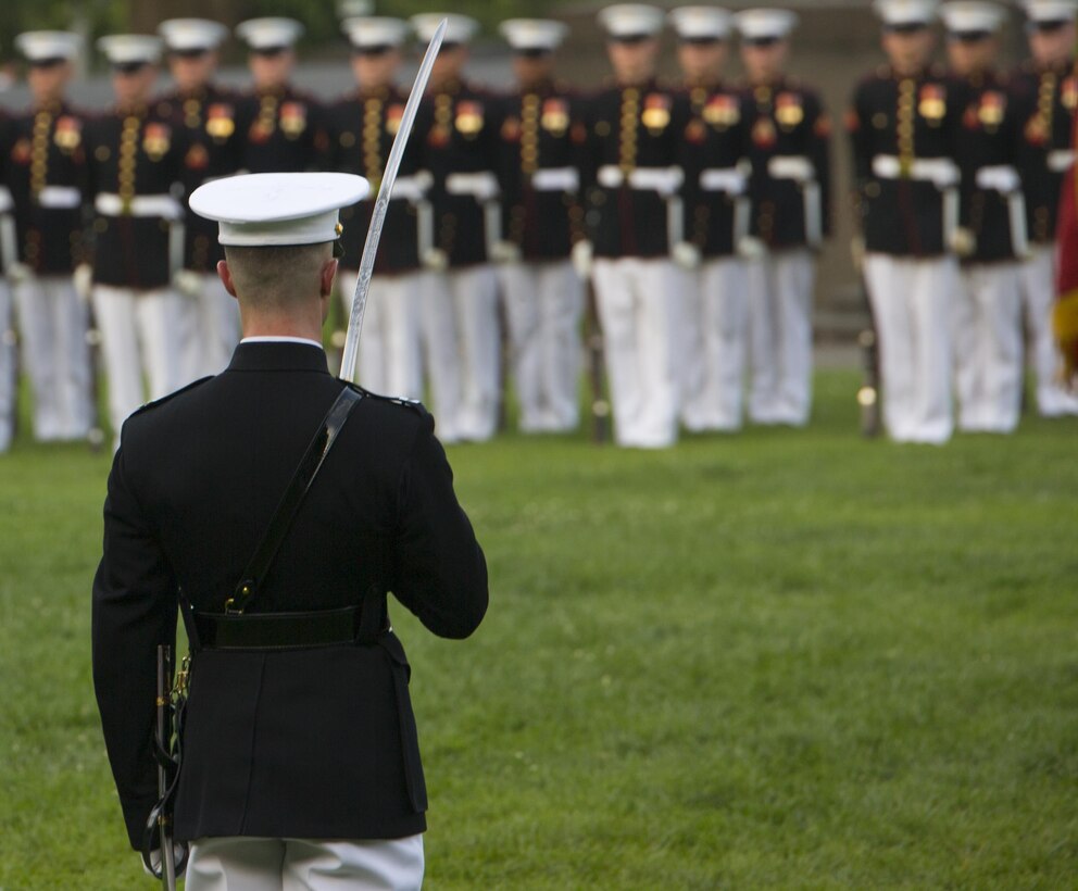 Marines from Marine Barracks Washington, D.C., perform during the Sunset Parade, July 5, 2016. The guests of honor for the parade were Mr. Brian L. Potts, majority staff director, Senate Appropriations Committee – Defense, Mr. Erik K. Raven, minority staff director, Senate Appropriations Committee – Defense, and Mrs. Rebecca Leggieri, House Appropriations Committee – Defense. The hosting official was Lt. Gen. Glenn M. Walters, deputy commandant, Programs and Resources. (Official Marine Corps photo by Lance Cpl. Robert Knapp/Released)