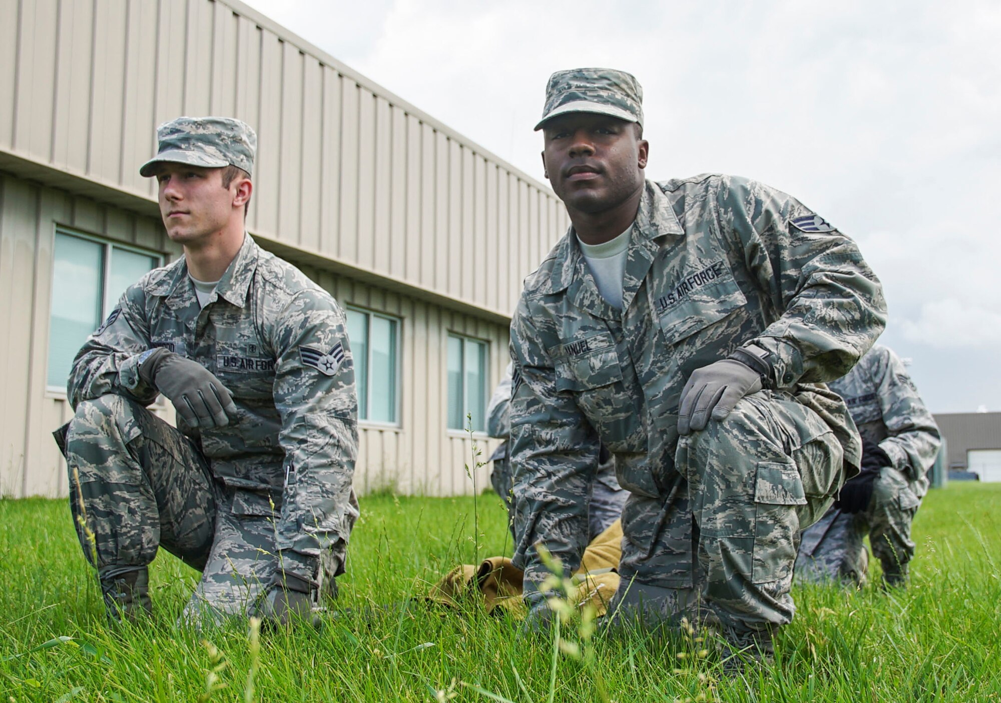 Senior Airman Andrae Manuel (far right), 445th Aeromedical Staging Squadron aerospace medical technician, prepares to carry a litter during training held June 5, 2016. Manuel is the 445th Airlift Wing July Spotlight Performer. (U.S. Air Force photo/Staff Sgt. Devin Long)