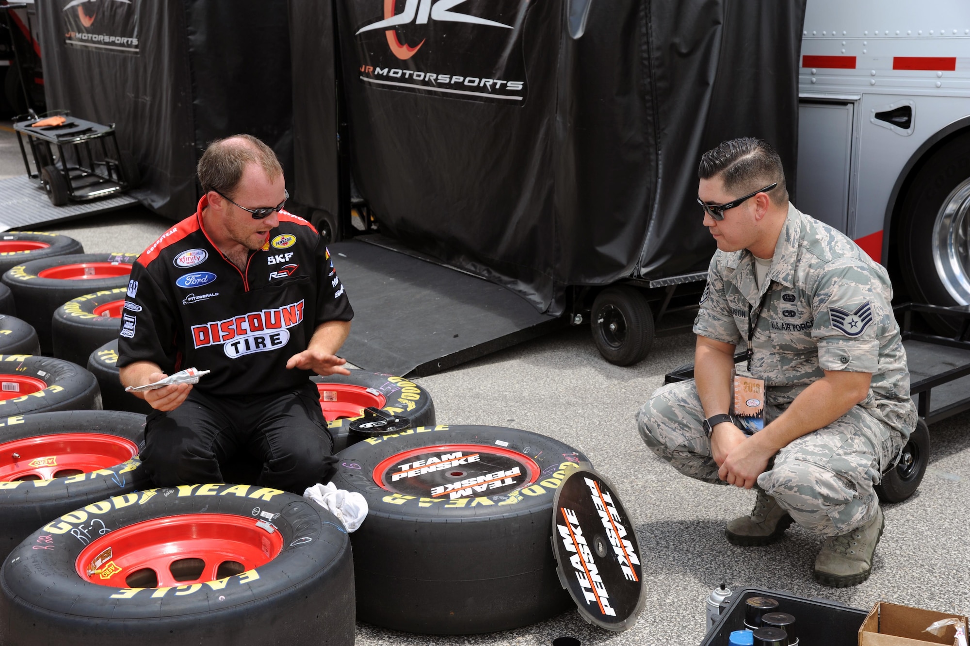 Airmen assigned to the 927th Air Refueling Wing, MacDill Air Force Base, Fla., were invited to participate in the honorary pit crew experience at the Coke Zero 400 NASCAR race at the Daytona International Speedway, Friday, July 1, 2016. Each Airmen and their guest were offered a chance to turn a wrench on a racecar and watch the team as they changed the tires and prepared the cars for the race. (U.S. Air Force photo by Staff Sgt. Adam C. Borgman)

