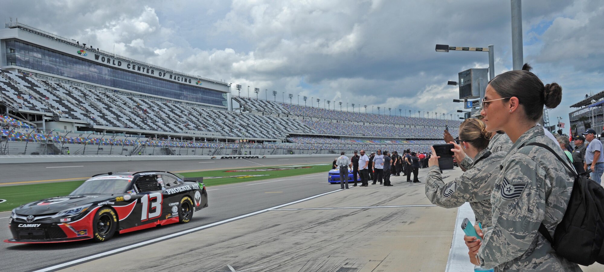 Airmen assigned to the 927th Air Refueling Wing, MacDill Air Force Base, Fla., were invited to participate in the honorary pit crew experience at the Coke Zero 400 NASCAR race at the Daytona International Speedway, Friday, July 1, 2016. Each Airmen and their guest were offered a chance to turn a wrench on a racecar and watch the team as they changed the tires and prepared the cars for the race. (U.S. Air Force photo by Staff Sgt. Adam C. Borgman)

