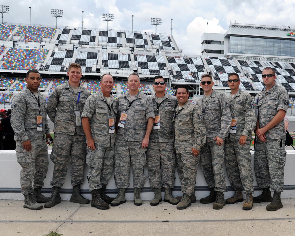 Airmen assigned to the 927th Air Refueling Wing, MacDill Air Force Base, Fla., were invited to participate in the honorary pit crew experience at the Coke Zero 400 NASCAR race at the Daytona International Speedway, Friday, July 1, 2016. Each Airmen and their guest were offered a chance to turn a wrench on a racecar and watch the team as they changed the tires and prepared the cars for the race. (U.S. Air Force photo by Staff Sgt. Adam C. Borgman)


