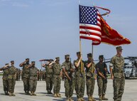Col. Timothy M. Salmon, outgoing commanding officer, Marine Corps Air Station New River, stands at attention in a change of command ceremony before being awarded the Legion of Merit with a gold star in lieu of second award for his service and leadership as commander of MCAS New River. Salmon turned over his command to Col. Russell C. Burton, after serving the air station and surrounding community for three years as the commanding officer.