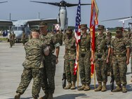 Col. Timothy M. Salmon, outgoing commanding officer, Marine Corps Air Station New River, receives the Legion of Merit with one gold star in lieu of second award from Brig. Gen. Thomas D. Weidley, Marine Corps Instillation East-Marine Corp Base Camp Lejeune Commanding General, for his action as the commanding officer June 23. Salmon served as the commanding officer of MCAS New River since July 2013 and was relieved by Col. Russell C. Burton. (U.S. Marine Corps photo by Lance Cpl. Tavairus Hernandez /released)