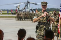 Col. Timothy M. Salmon, outgoing commanding officer, Marine Corps Air Station New River, thanks family, friends and guests during his speech at a change of command ceremony on MCAS New River June 23. Salmon has served as the commanding officer of MCAS New River since July of 2013 and was relieved by Col. Russell C. Burton. (U.S. Marine Corps photo by Lance Cpl. Tavairus Hernandez /released)