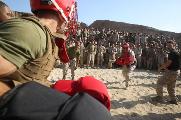 Marines with 1st Light Armored Reconnaissance Battalion, 1st Marine Division participate in pugil sticks matches during the battalion’s annual Highlander Night aboard Marine Corps Base Camp Pendleton, Calif., June 30, 2016. The Highlander Night tightens the bonds of brotherhood through competitions that pit unit against unit. (U.S. Marine Corps photo by Lance Cpl. Timothy Valero/ Released)