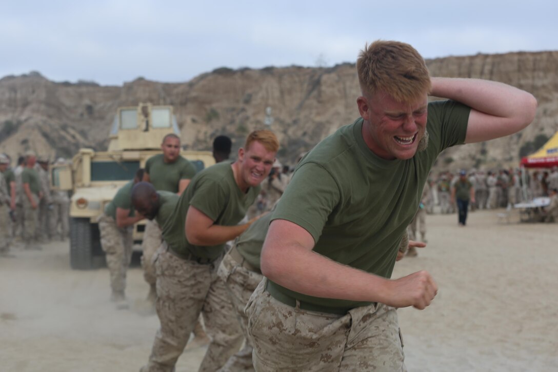 Marines with 1st Light Armored Reconnaissance Battalion 1st Marine Division, conduct timed Humvee pulls during the battalion’s Highlander Night aboard Marine Corps Base Camp Pendleton, Calif., June 30, 2016.  The intramural competitions strengthened the bonds between the Marines working in teams. (U.S. Marine Corps photo by Lance Cpl. Timothy Valero/ Released)