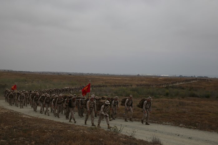 Marines with 1st Light Armored Reconnaissance Battalion, 1st Marine Division, conduct a six-mile hike to Red Beach where the battalion held its annual Highlander Night aboard Marine Corps Base Camp Pendleton, Calif., June 30, 2016. The Highlander Night brings the battalion together to strengthen their brotherhood and esprit-de-corps through a warrior’s fest and competition. (U.S. Marine Corps photo by Lance Cpl. Timothy Valero/ Released)