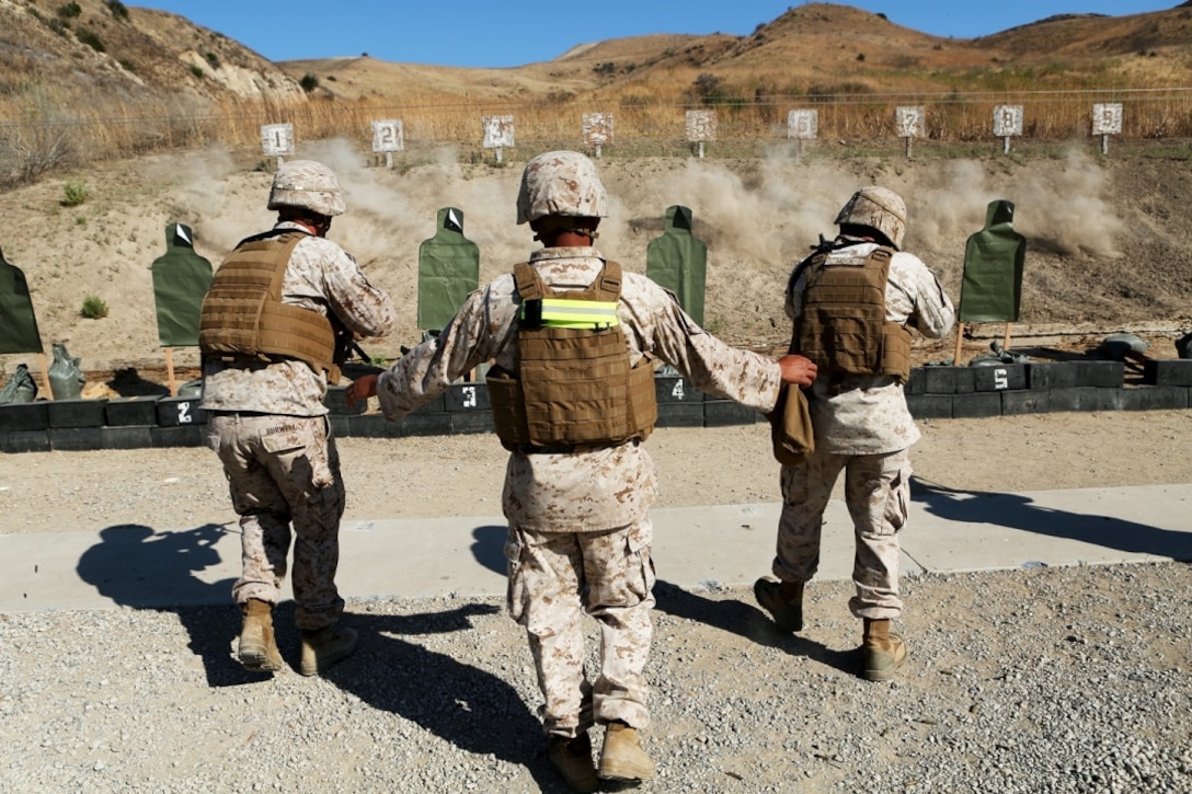 U.S. Marine Sgt. Us Chanthavixay coaches students in the table three course of fire during the Combat Leader’s Course aboard Camp Pendleton Calif., from June 13-24, 2016. Chanthavixay is an instructor at the Combat Skills Training School , 1st Marine Logistics Group. Combat Leader’s Course is an advanced combat skills course instructed by the CSTS, designed to teach Marines tactical leadership principles, machine gun functions, combat orders and various other skills. (U.S. Marine Corps photo by Sgt. Carson Gramley/released)