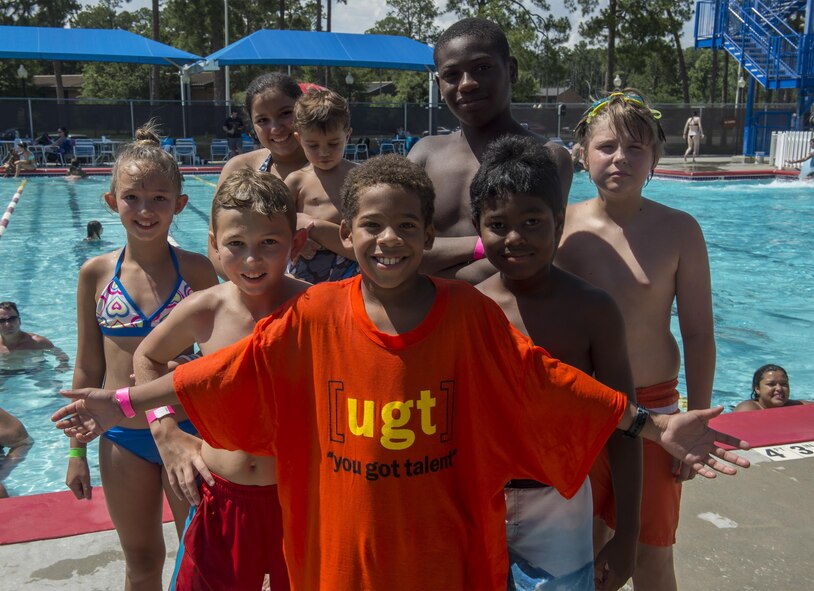 Members of Team A.S.B. pose for a photo after winning 2nd place in the frozen T-shirt contest during the Red, White and Blue Splash Party at the base pool, July 4, 2016 at Moody Air Force Base, Ga. Team Ugly Monkey only beat them by a few seconds to earn bragging rights and a door prize. (U.S. Air Force photo by Tech. Sgt. Zachary Wolf/Released)
