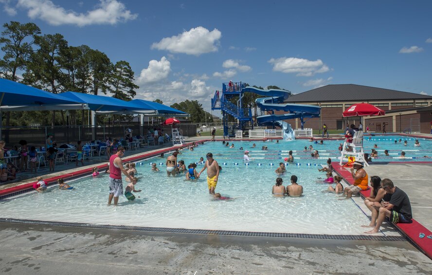 Airmen and their families celebrate Independence Day during the Red, White and Blue Splash Party at the base pool, July 4, 2016 at Moody Air Force Base, Ga. This event provided a friendly environment for those to celebrate Independence Day with friends and family on base. (U.S. Air Force photo by Tech. Sgt. Zachary Wolf/Released)