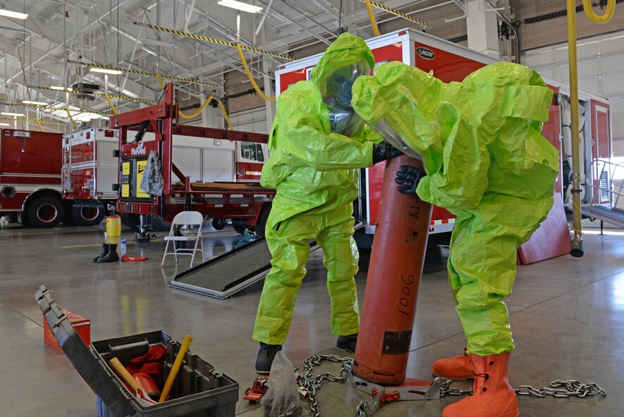 Senior Airman Bradley Willock (left), 940th Civil Engineer Squadron (CES) firefighter, and Airman Joseph Brandt, 9th CES firefighter, conduct hazardous material containment training June 30, 2016, at Beale Air Force Base, California. Beale’s Fire Departments conduct daily proficiency training to remain ready to respond for an incident. (U.S. Air Force photo by Senior Airman Ramon A. Adelan)