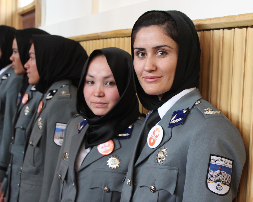 The women pictured were among 389 graduates of the Afghan National Police (ANP) Basic Police Officer Training waiting to be recognized in Kabul, Afghanistan, March 13, 2016. Memphis District engineers are participating in a Reachback Engineering project that supports increasing the ANP’s capacity to house and train more female officers to combat insurgency. An increase in the number of trained female officers enhances the ANP’s effectiveness because female officers can enter certain places and form bonds with other females in the community that their male counterparts cannot due to cultural propriety. (U.S. military photo by Lt. Charity Edgar/Released)