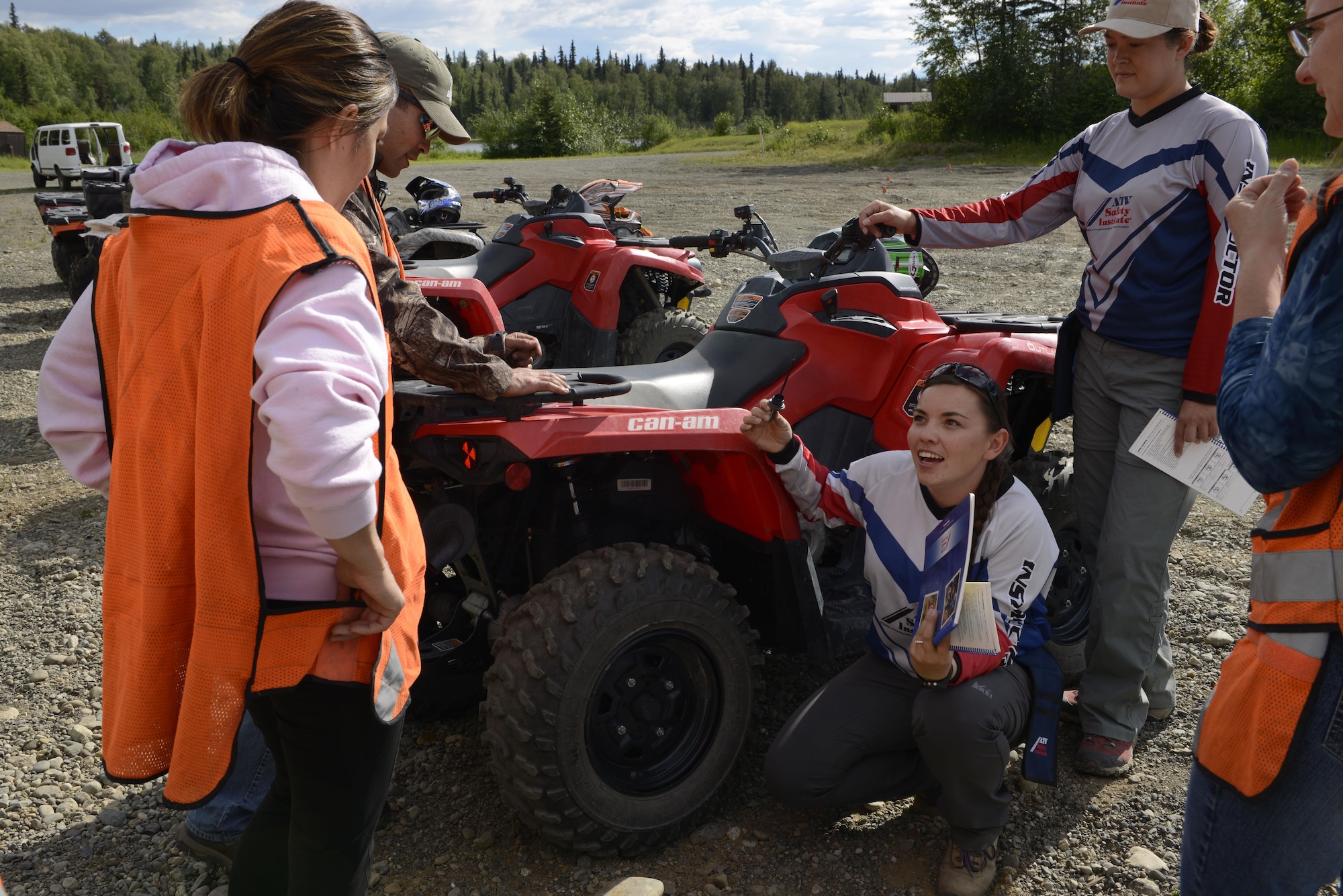 Students learn how to check the oil of their all-terrain vehicle during an ATV safety course at the Hillberg Ski Resort at Joint Base Elmendorf-Richardson, June 29, 2016. During the class, students learned an ATV handles differently from other vehicles and proper precautions must be taken to ride safely. (U.S. Air Force photo by Airman 1st Class Valerie Monroy)