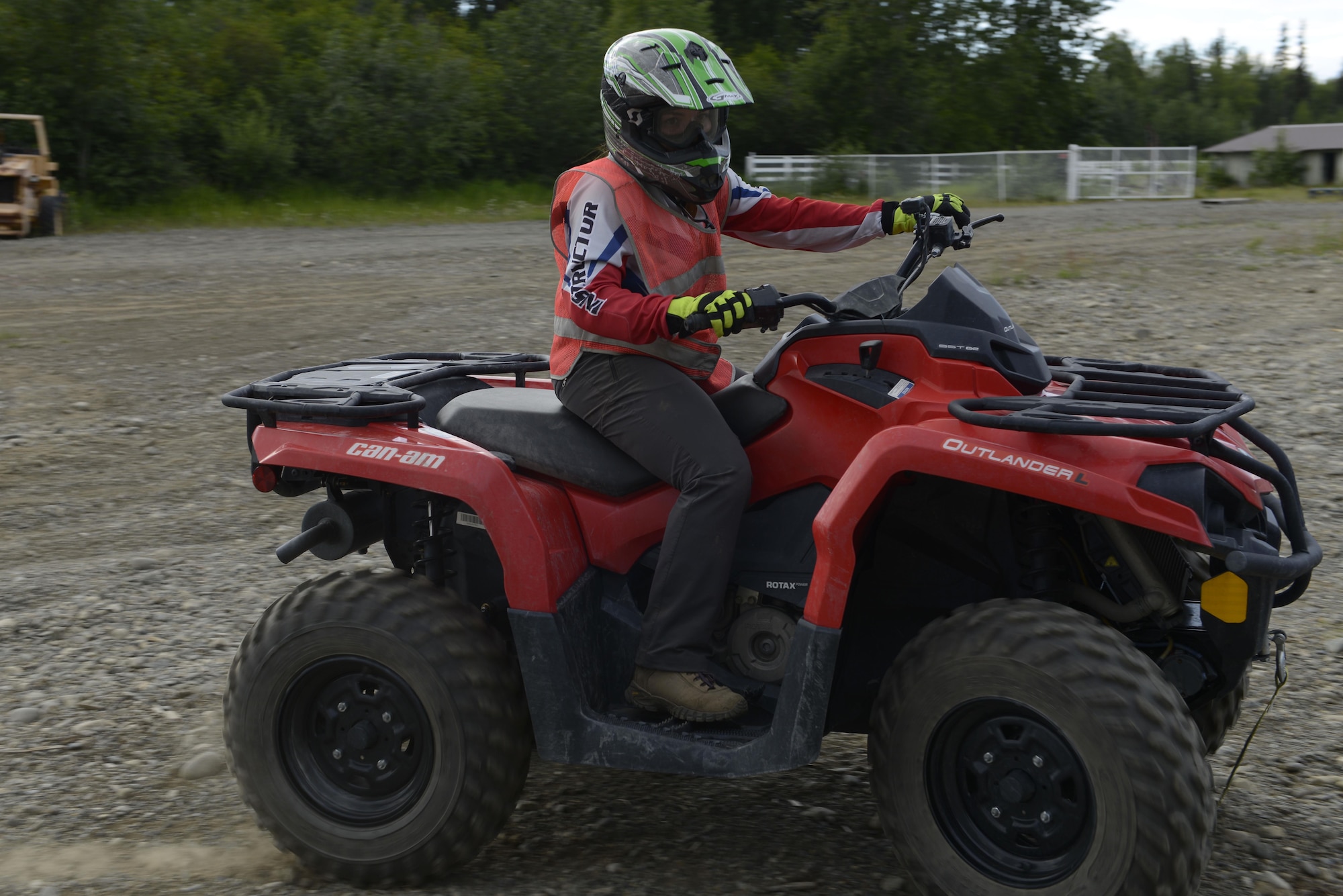 Kate Thompson, an all-terrain vehicle instructor with the Outdoor Adventure Program, shows students how to properly turn during an ATV safety course at the Hillberg Ski Resort at Joint Base Elmendorf-Richardson, June 29, 2016. During the class, students were informed on the proper equipment needed to operate an ATV safely. (U.S. Air Force photo by Airman 1st Class Valerie Monroy)
