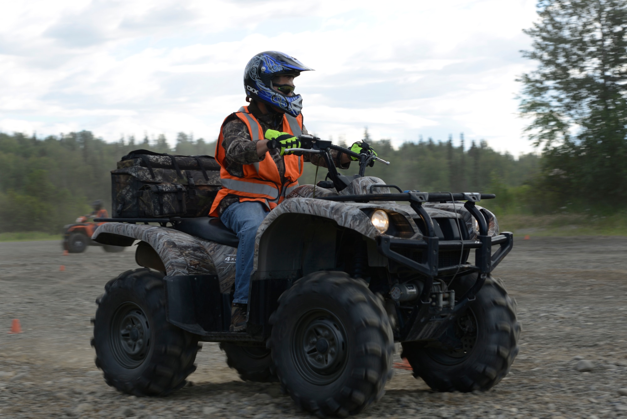 Sgt. 1st Class Chris Coyle, with the 1st Squadron (Airborne), 40th Cavalry Regiment, 4th Infantry Brigade Combat Team (Airborne), 25th Infantry Division, U.S. Army Alaska, practices a turn during an all-terrain vehicle safety course at the Hillberg Ski Resort at Joint Base Elmendorf-Richardson, June 29, 2016. The course gives riders the skills necessary to safely operate the vehicles and to quickly react in an emergency situation. (U.S. Air Force photo by Airman 1st Class Valerie Monroy)
