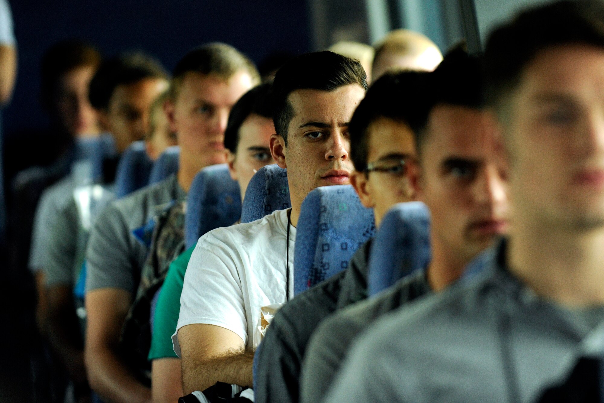 Cadet trainees share a pensive moment June 30, 2016,while traveling to the cadet area via bus to begin Basic Cadet Training. In all, 1,157 young adults were scheduled to report to the Academy for BCT, a six-week mental and physical training program. (U.S. Air Force photo/Jason Gutierrez)