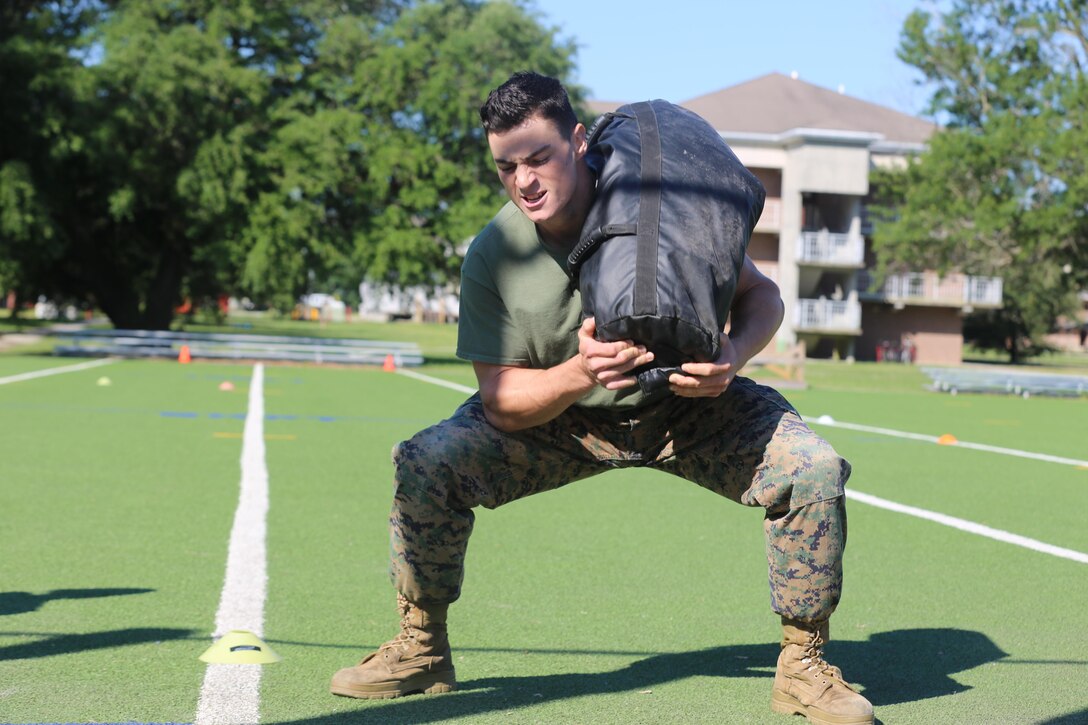 Sgt. Nick Perrorazio, a machine gunner with 2nd Battalion, 8th Marine Regiment demonstrates a sandbag squat during the 2016 Tactical Athlete of the Year competition at the High Intensity Tactical Training center on Marine Corps Base Camp Lejeune, June 13. The competition is being held yearly to find the fittest tactical athletes in the Marine Corps. Winners from Marine Corps Installations – East will go on to compete at Marine Corps Air Station Miramar to earn the title of Tactical Athlete of the Year. 