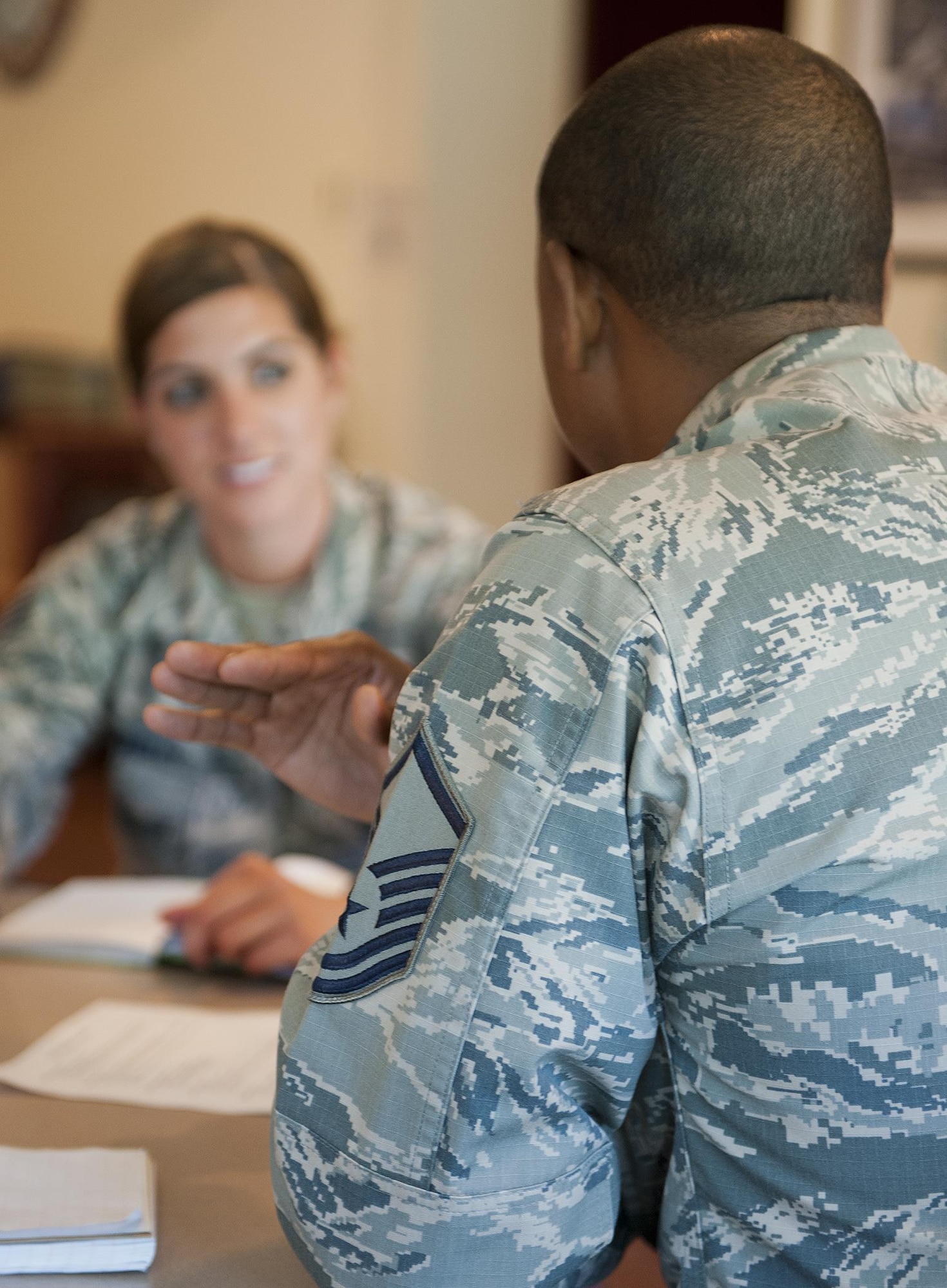 A master sergeant gives professional development advice to a junior enlisted Airman during a speed-mentoring session June 24. Similar to the speed-dating concept, senior enlisted mentors from the Eglin Air Force Base and Hurlburt Field Top 3 organizations provided seven-minute, one-on-one sessions to 15 staff and technical sergeants from the 96th Logistics Readiness Squadron. When each segment was up, mentors rotated out, giving junior Airmen an opportunity to interface with every mentor in the room. (U.S. Air Force Photo/Jasmine Porterfield)