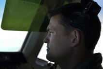 U.S. Air Force Capt. Brad Mcelvain, 9th Air Refueling Squadron KC-10 Extender pilot, looks to the horizon while flying a refueling mission in support of F-35A Lightning IIs over the Atlantic Ocean June 30, 2016. The F-35A is the Air Force’s newest fifth generation fighter aircraft and is capable of multiple roles for air superiority. (U.S. Air Force photo by Staff Sgt. Natasha Stannard)