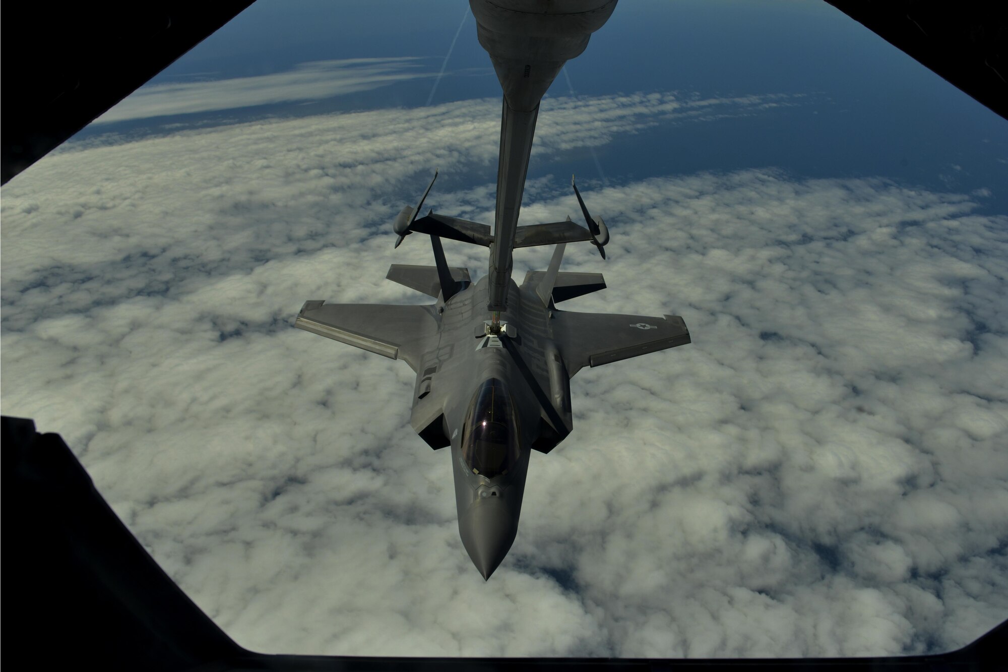 A U.S. Air Force F-35A Lightning II is refueled by a KC-10 Extender over the Atlantic Ocean on the way to Fairford, England, June 30, 2016. This flight marked the first U.S. transatlantic flight of the F-35A. (U.S. Air Force photo by Staff Sgt. Natasha Stannard)