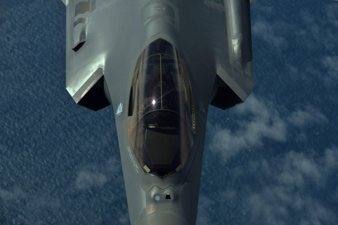 A U.S. Air Force F-35A fighter pilot flies over the Atlantic Ocean for the aircraft’s first transatlantic flight June 30, 2016. The F-35A is a part of the Air Combat Command Air Force Heritage Flight Team, which flew to Fairford, England, for the Royal International Air Tattoo. (U.S. Air Force photo by Staff Sgt. Natasha Stannard)
