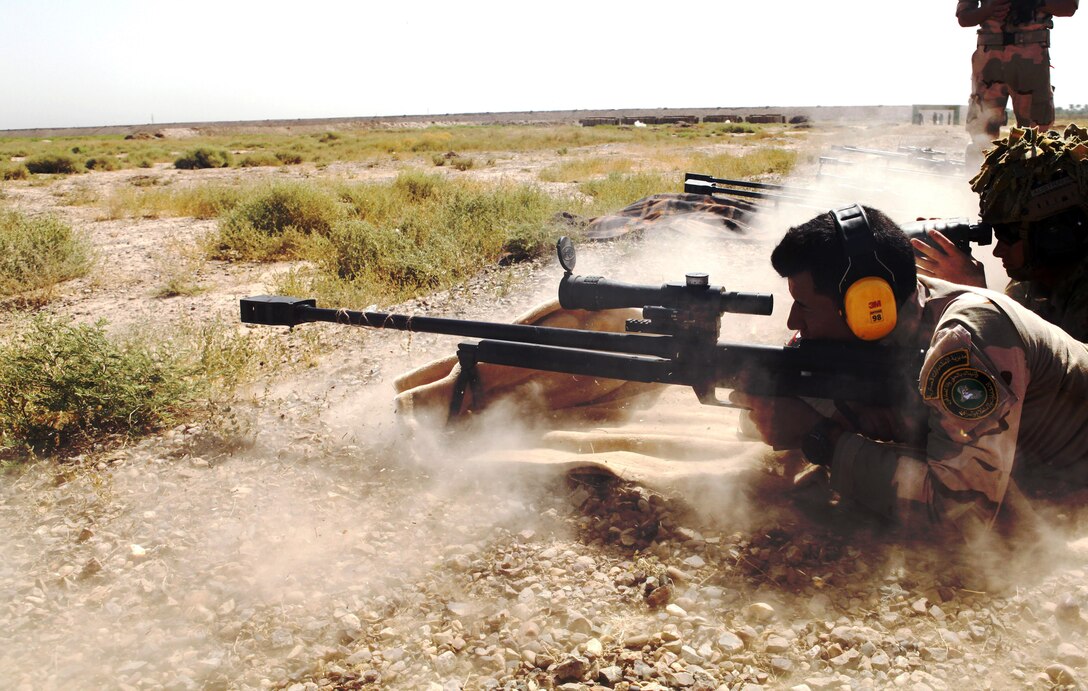 An Iraqi soldier fires a .50-caliber sniper rifle as an Australian soldier attached to Task Group Taji spots a target for him during a zeroing class at Camp Taji, Iraq, June 22, 2016. The ability to accurately fire a .50-caliber sniper rifle will supplement the Iraqi soldiers’ overall tactical capabilities. Training at the building partner capacity sites is an integral part of Combined Joint Task Force – Operation Inherent Resolve’s multinational effort to train Iraqi security forces personnel to defeat the Islamic State of Iraq and the Levant. Army photo by Sgt. Joshua Powell